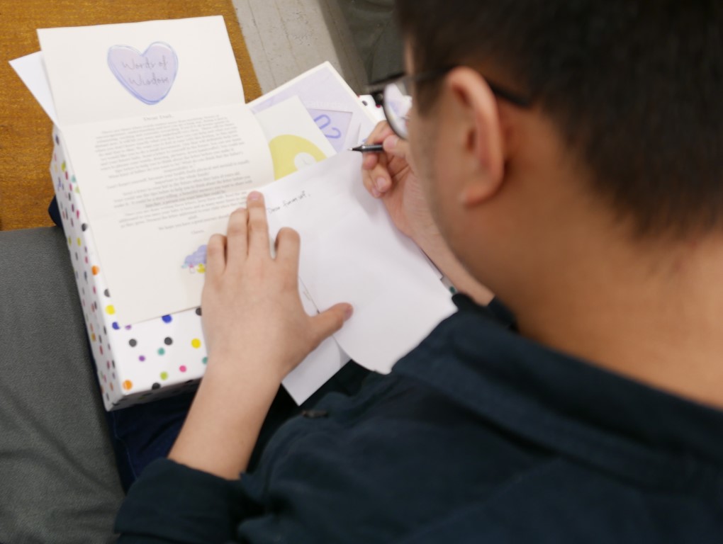A man writes a letter